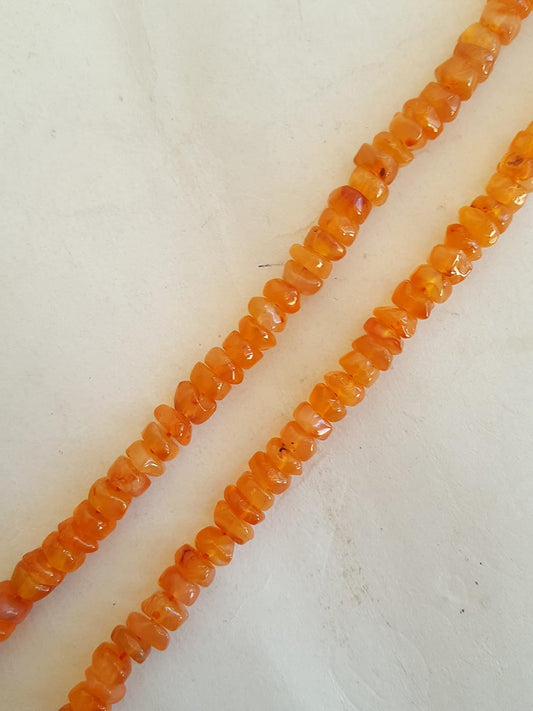 A strand crafted from  natural carnelian gemstone, with beads sized 6mm, radiating warmth and elegance.