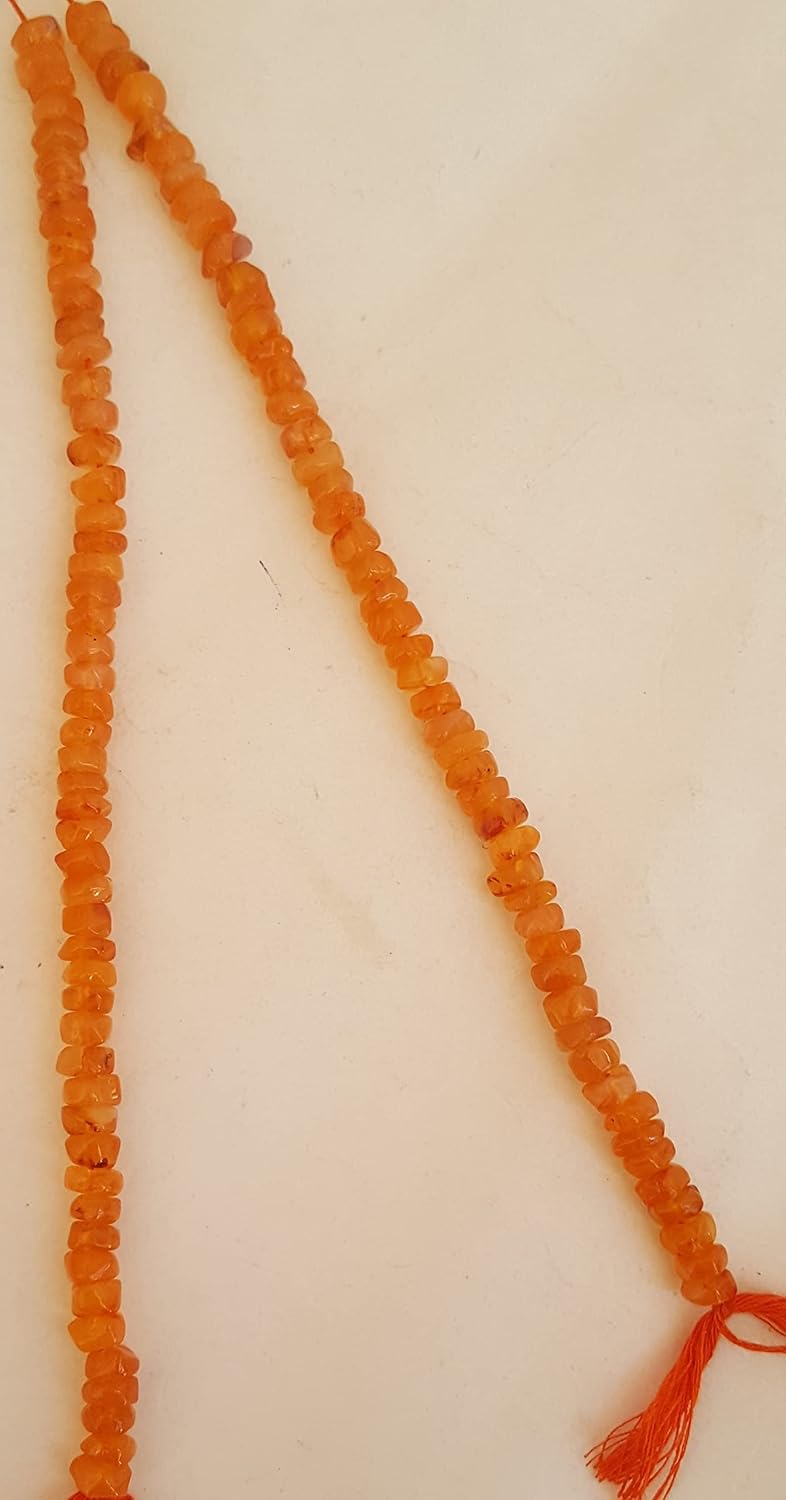Elegant strand adorned with 6mm smooth carnelian wheel beads, highlighting their rich orange hue.