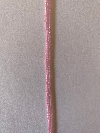 A long strands of 2-2.2mm chalcedony beads, showcasing a pink faceted rondelles, ideal for crafting and design.