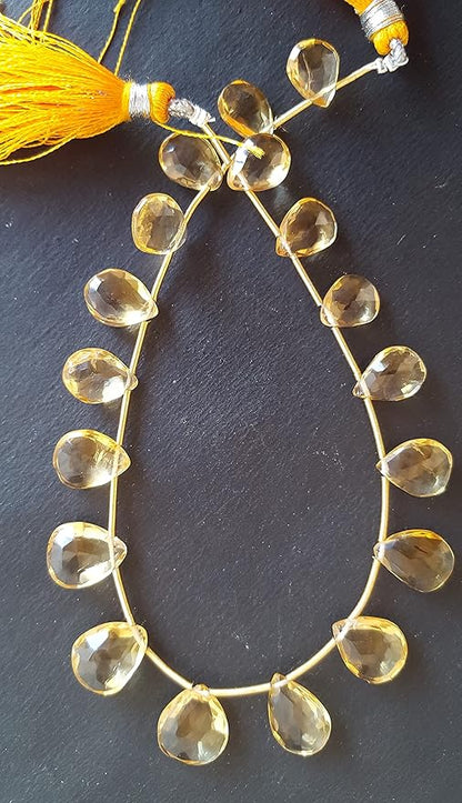  A striking strand with yellow beads resting on a black surface, showcasing the vivid colours and elegant design.