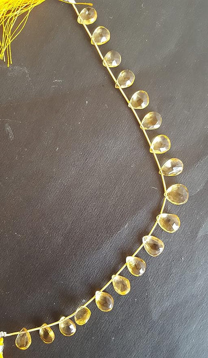 Elegant strand adorned with yellow Citrine faceted pear beads, perfect for adding a pop of colour.