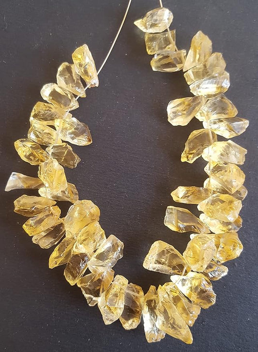 Strands featuring yellow citrine gemstones.