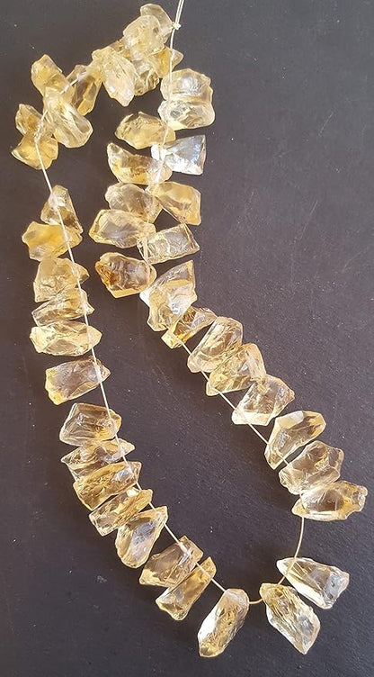 Strands featuring yellow citrine gemstones, each bead measuring 7mm to 9mm, showcasing a rough, natural texture.