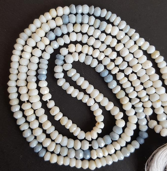 A long strand of 3.5mm denim opal beads, showcasing faceted rondelles, ideal for crafting and design.