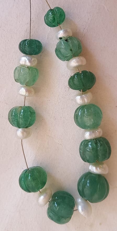 Green emeralds bead adorned with freshwater pearls, showcasing a carved rondelle design, measuring 7mm to 10mm.