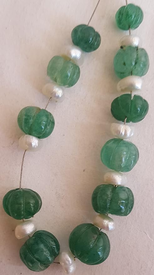 A striking green emerald beads with pearls, featuring a carved rondelle design, sizes from 7mm to 10mm for elegant jewellery.