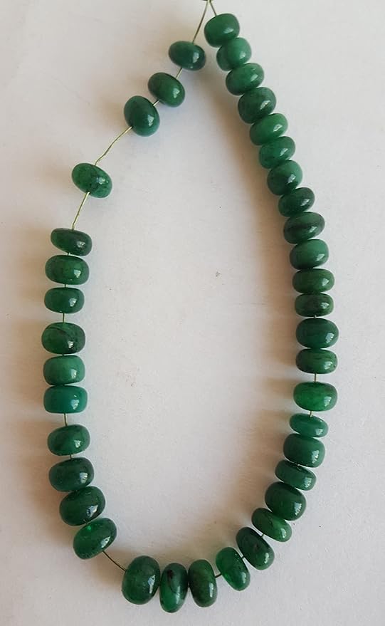 A strand crafted from green natural emerald gemstone, with beads sized between 5mm and 6mm, radiating warmth and elegance.