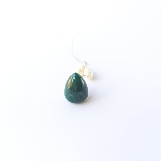 Genuine Emerald stone bead showcasing its smooth teardrop shape and vibrant green tone.