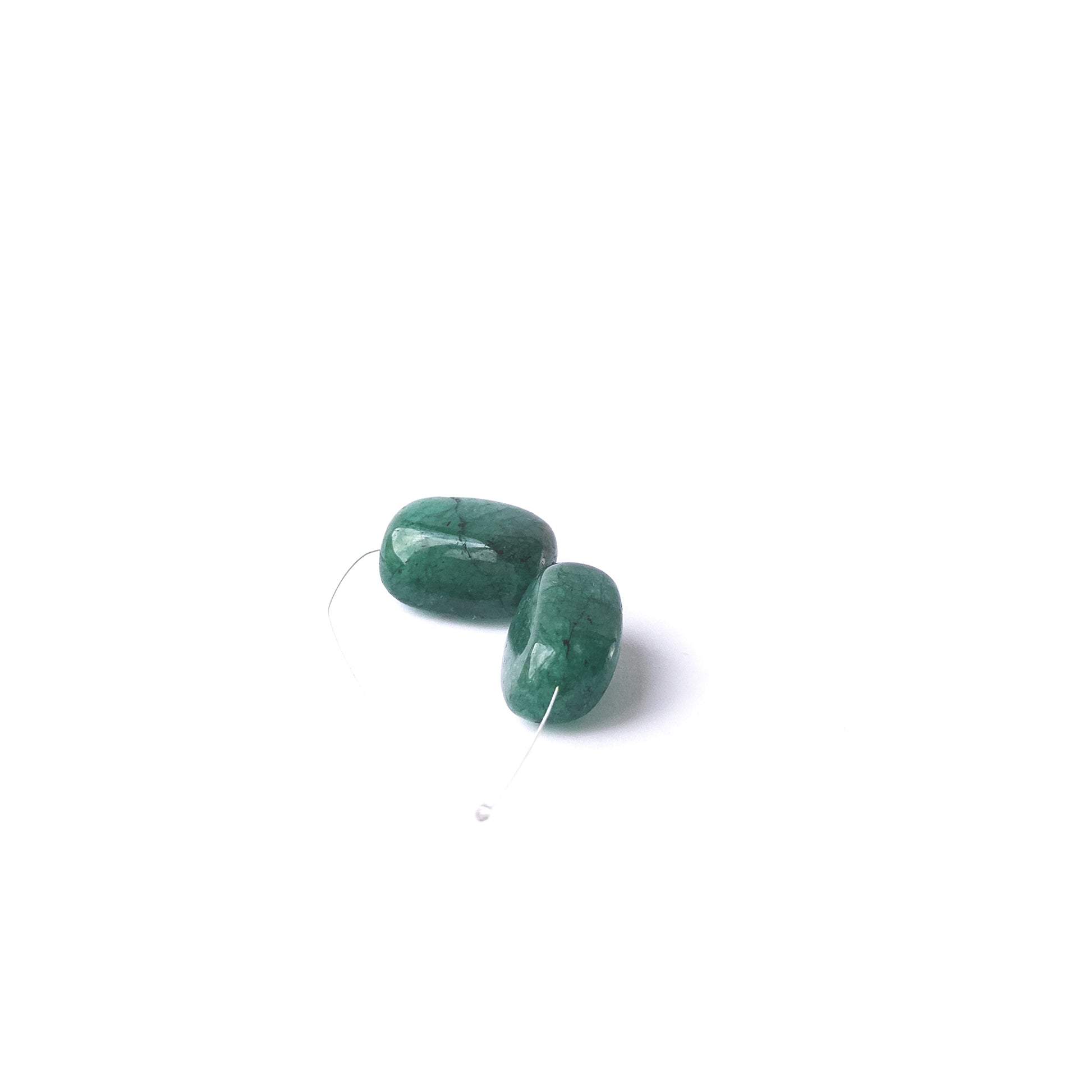 High‑quality Emerald stone beads arranged neatly for handmade jewellery components and beadwork.