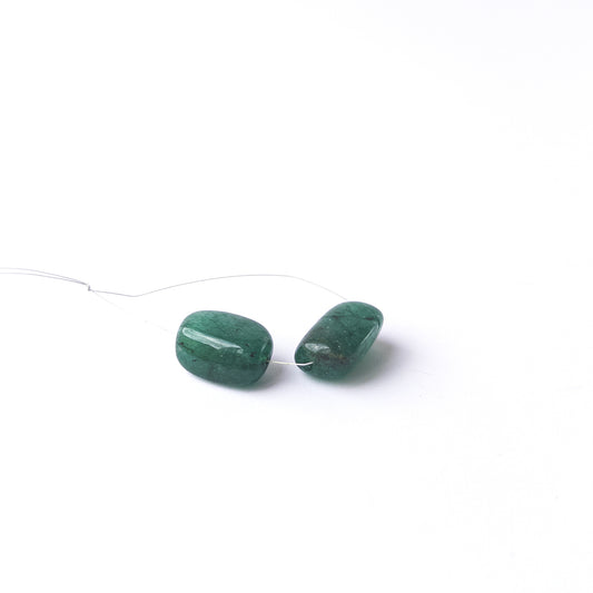 Emerald smooth tumble gemstone beads with rich green colour arranged in a two‑piece set for jewellery making.