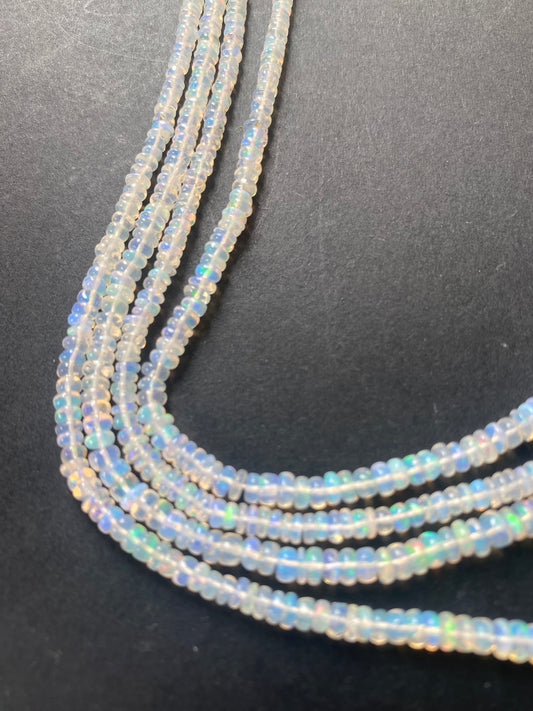 Elegant gemstone strand adorned with smooth white opal beads.
