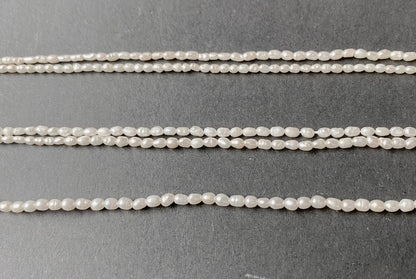 Softly glowing rice-shaped pearls showcasing a refined shimmer and organic beauty.