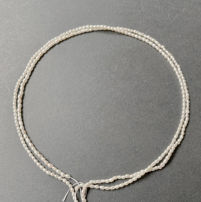 A close-up of Fresh Water Pearls with smooth curves and delicate lustre.