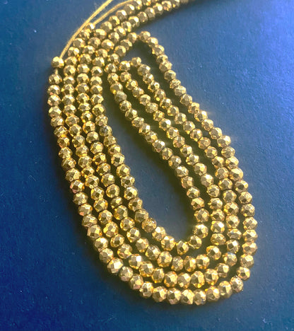 Lustrous Gold Pyrite Faceted Rondelle beads, 2.2-2.3mm, elegantly strung on a 31cm strand.