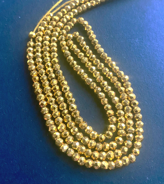Lustrous Gold Pyrite Faceted Rondelle beads, 2.2-2.3mm, elegantly strung on a 31cm strand.
