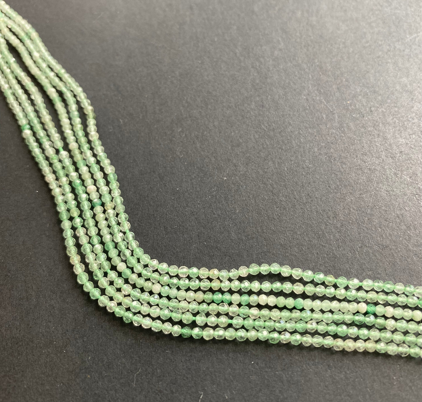 Elegant strand adorned with 2.2mm faceted rondelle amethyst stones, showcasing a rich green colour.