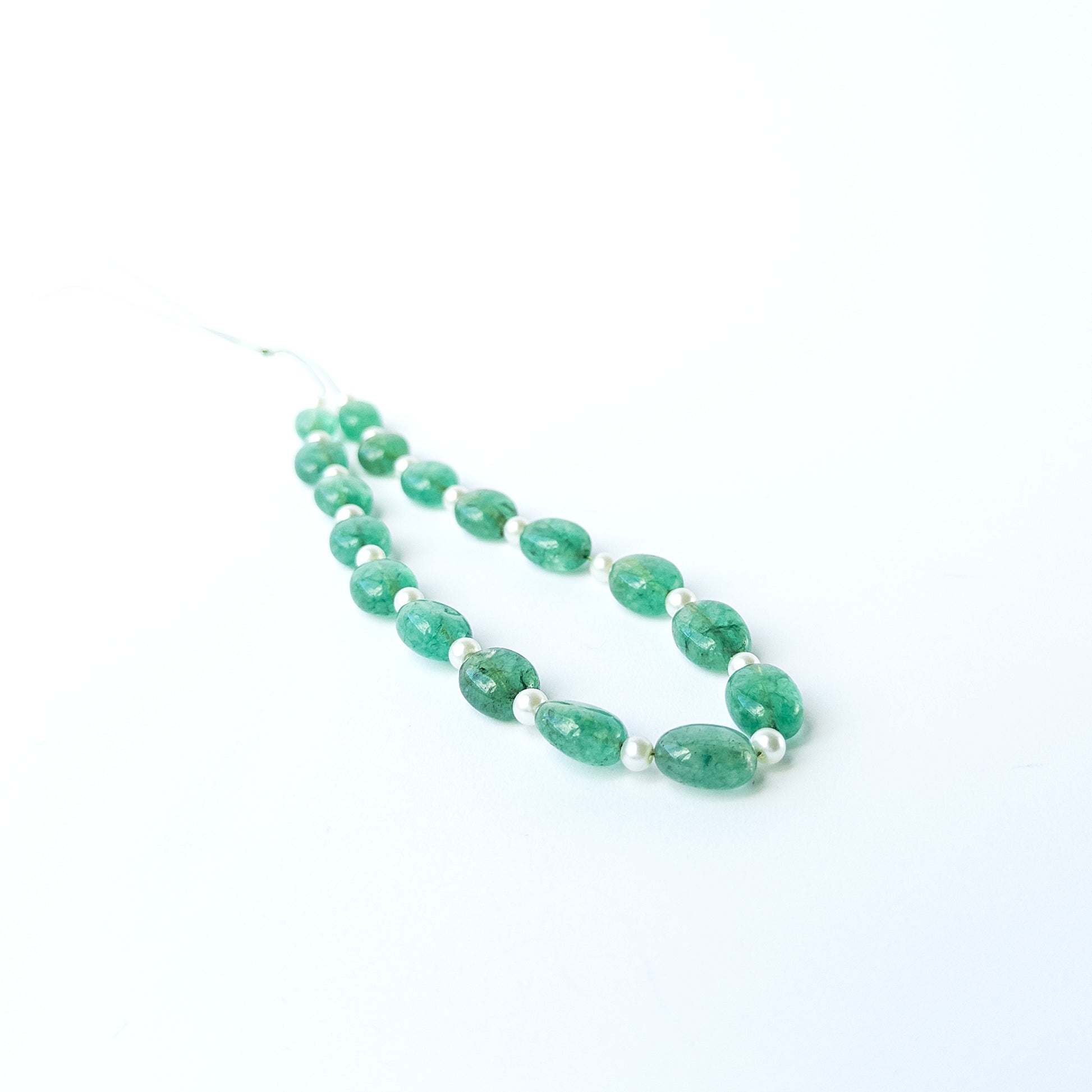 Authentic Green Beryl and Shell Pearl oval beads showcasing smooth finish and elegant colour contrast.