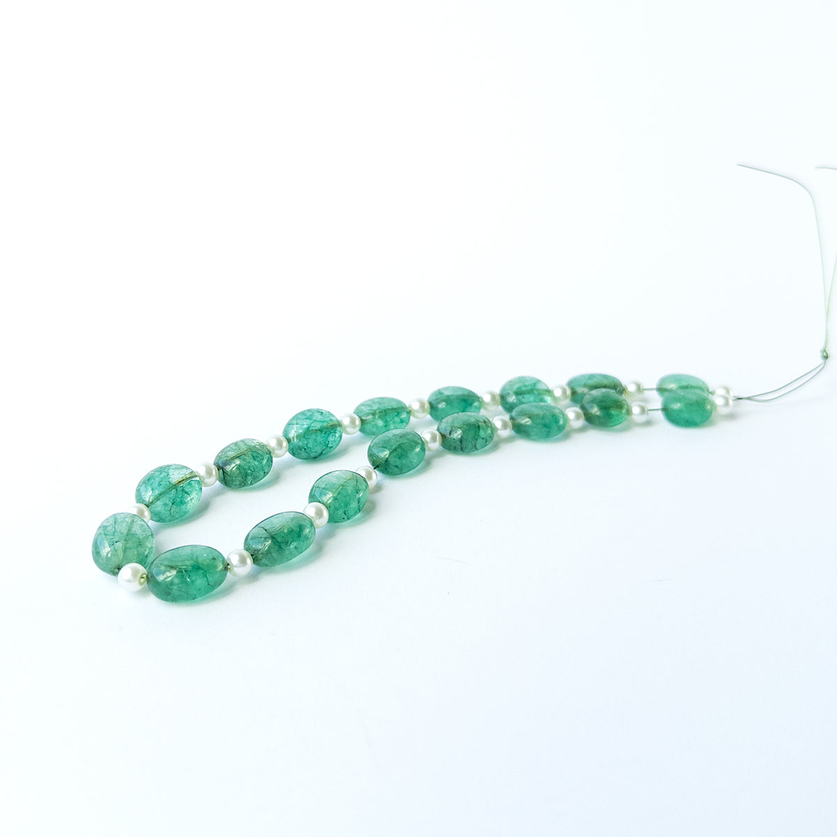 High‑quality mixed gemstone and pearl beads arranged neatly for handmade jewellery components.