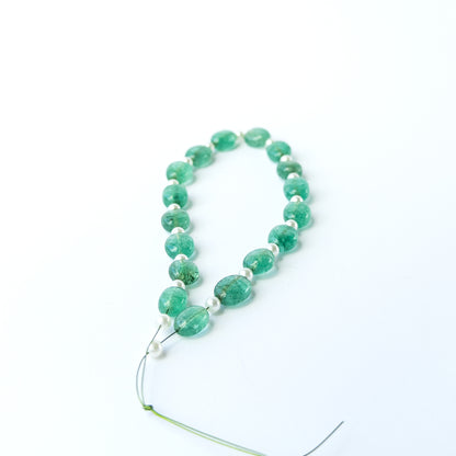Smooth oval Green Beryl and Shell Pearl beads with refined shaping and natural lustre.