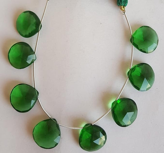 A strand of hydro beads, showcasing a green faceted heart shape, ideal for crafting and design.