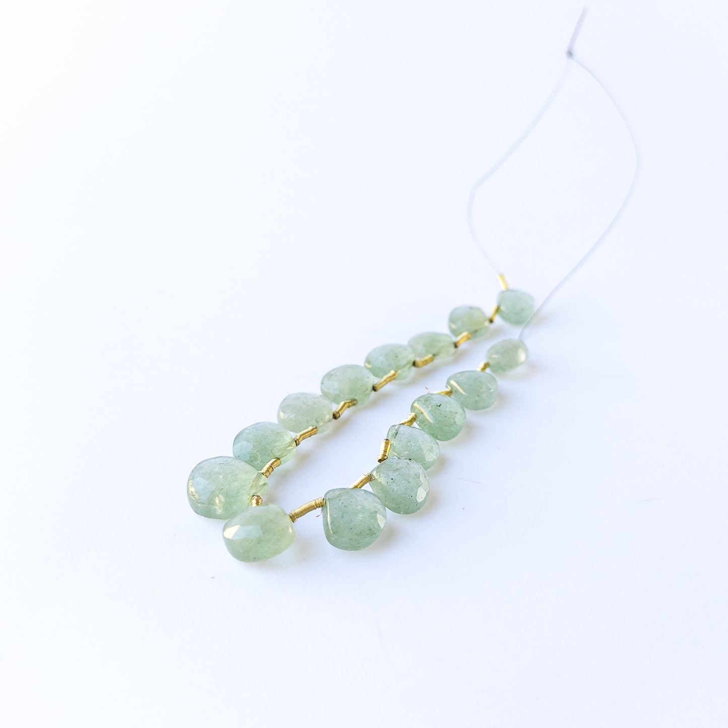 Green Strawberry Quartz faceted briolette gemstone beads with fresh green sparkle arranged in a 10.2–12.7mm set.