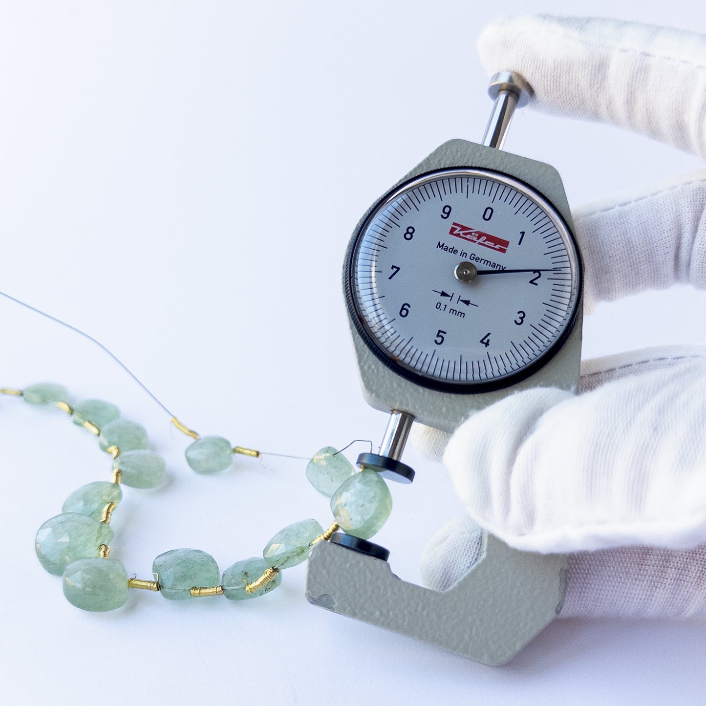 High‑quality Green Strawberry Quartz stone beads arranged neatly for handmade jewellery components.