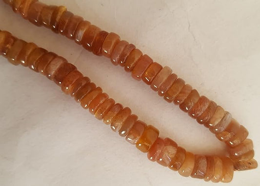 A strand displaying colourful stones, crafted from smooth wheel-shaped Heishi gemstone beads.