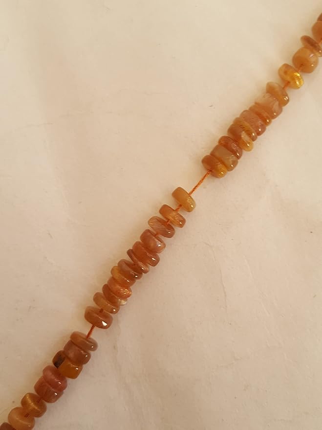 A stunning strand adorned with various coloured Heishi gemstone beads, showcasing smooth wheel designs.