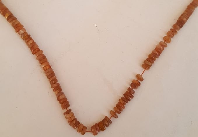 A vibrant strand featuring an array of colourful Heishi gemstone beads in smooth wheel shapes.