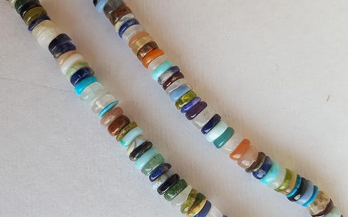 A vibrant strand featuring an array of colourful Heishi gemstone beads in smooth wheel shapes.