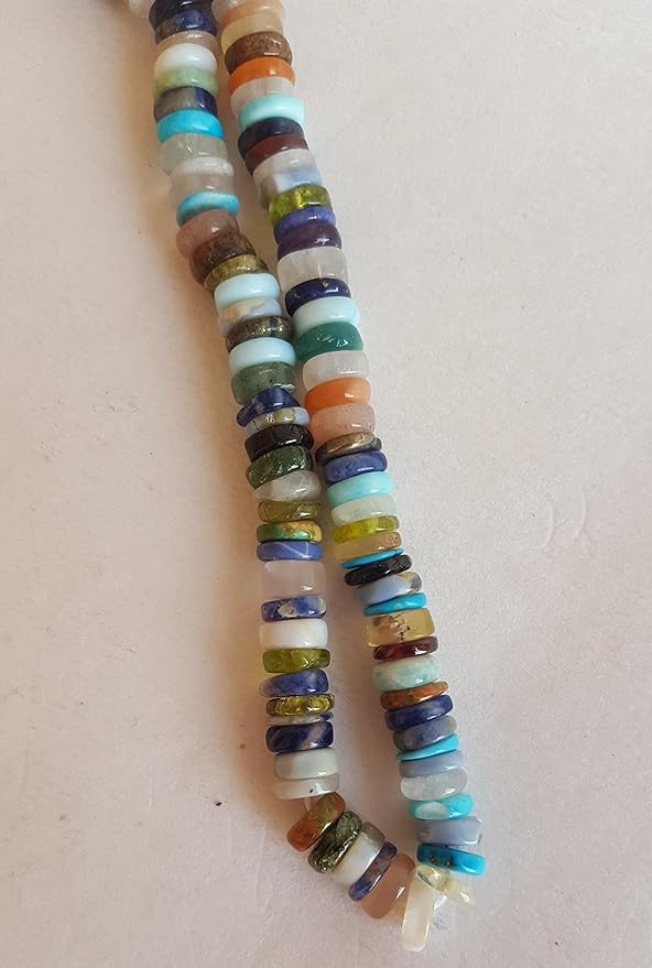 A colourful strand made of smooth wheel-shaped Heishi gemstone beads in multiple hues.