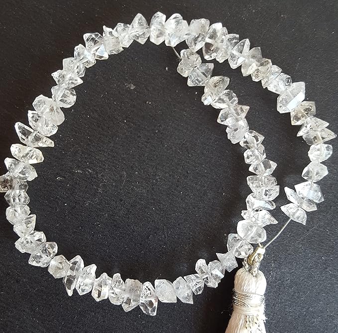 Featuring clear beads, a silver tassel, and Herkimer Diamond rough centre-drilled beads for a unique design.