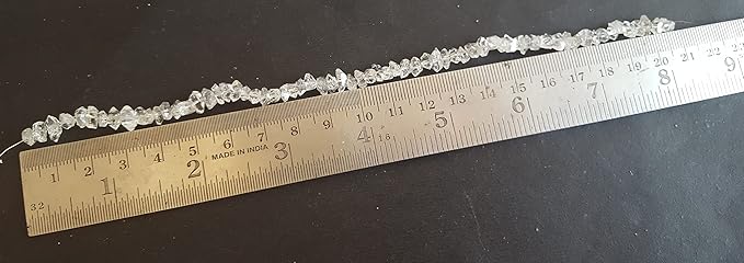 A ruler featuring a Herkimer Diamond and rough centre-drilled beads, ideal for jewellery making or artistic projects.