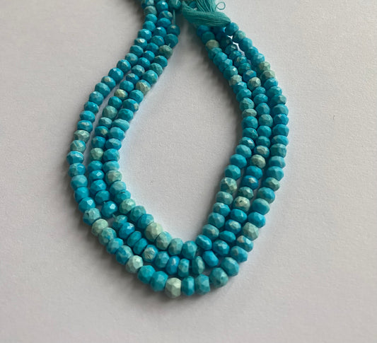 Strands of Howlite Turquoise beads, faceted rondelle style, measuring 4.5-5.0mm in size.