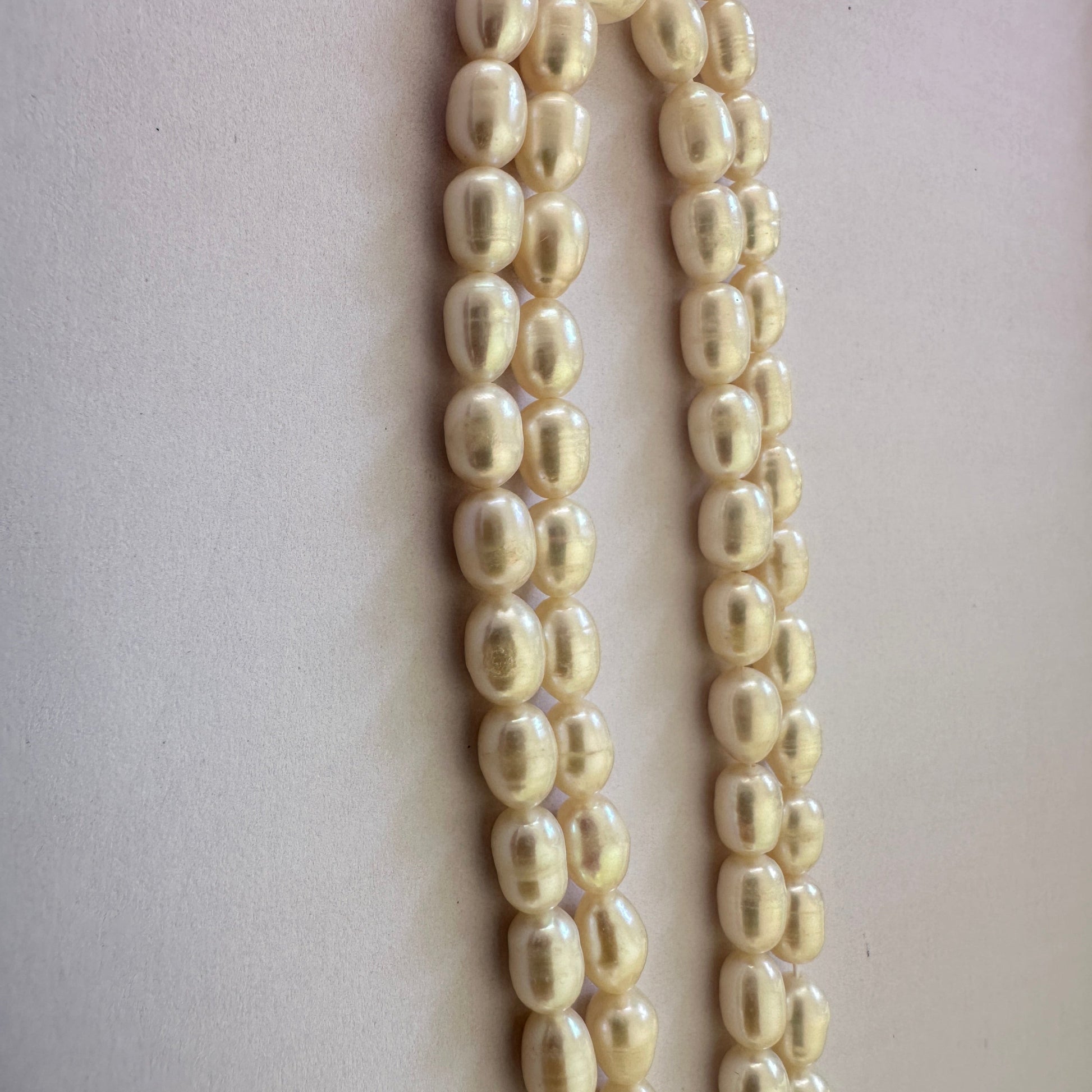 Neatly strung oval Freshwater Pearls in varying sizes with smooth finish.