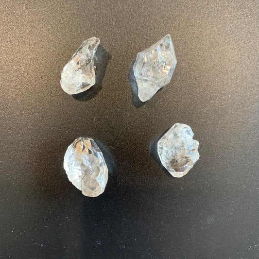 Herkimer Diamond rough undrilled crystals shimmer with remarkable transparency and organic inclusions.