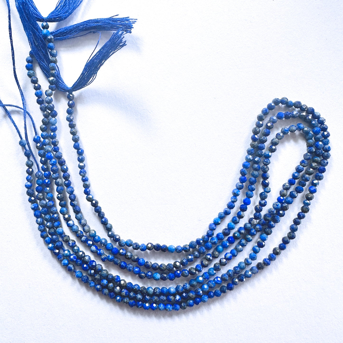 Faceted Lapis Lazuli beads with consistent 2.5mm sizing and elegant colour across a polished strand.