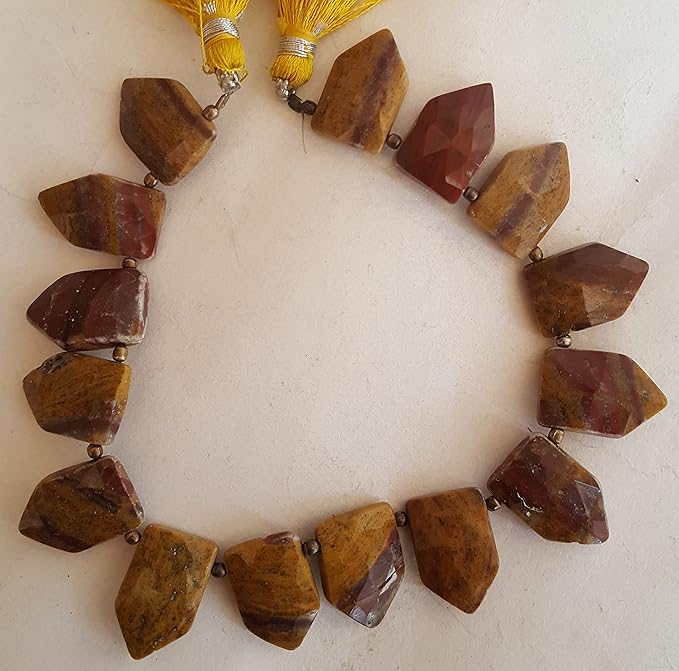 A strand crafted from natural Jasper gemstone, with beads sized between 11mm and 17mm, radiating warmth and elegance.