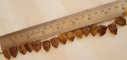 Jasper gemstone beads, sized 11mm to 17mm, displayed next to a ruler for scale.