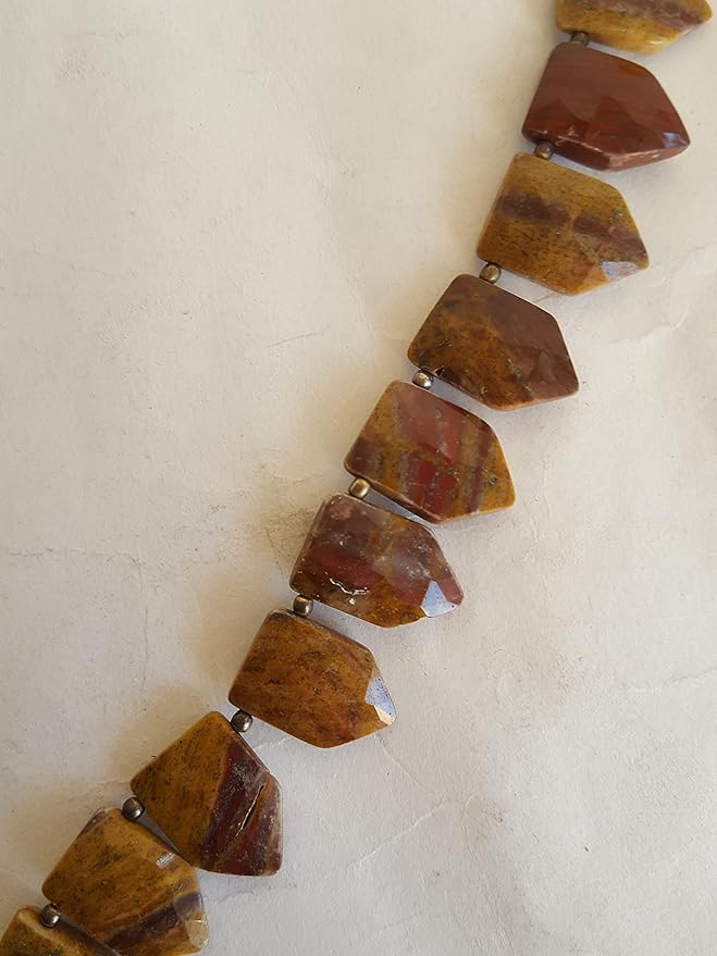 A strand crafted from  natural Jasper gemstone, with beads sized between 11mm and 17mm, radiating warmth and elegance.
