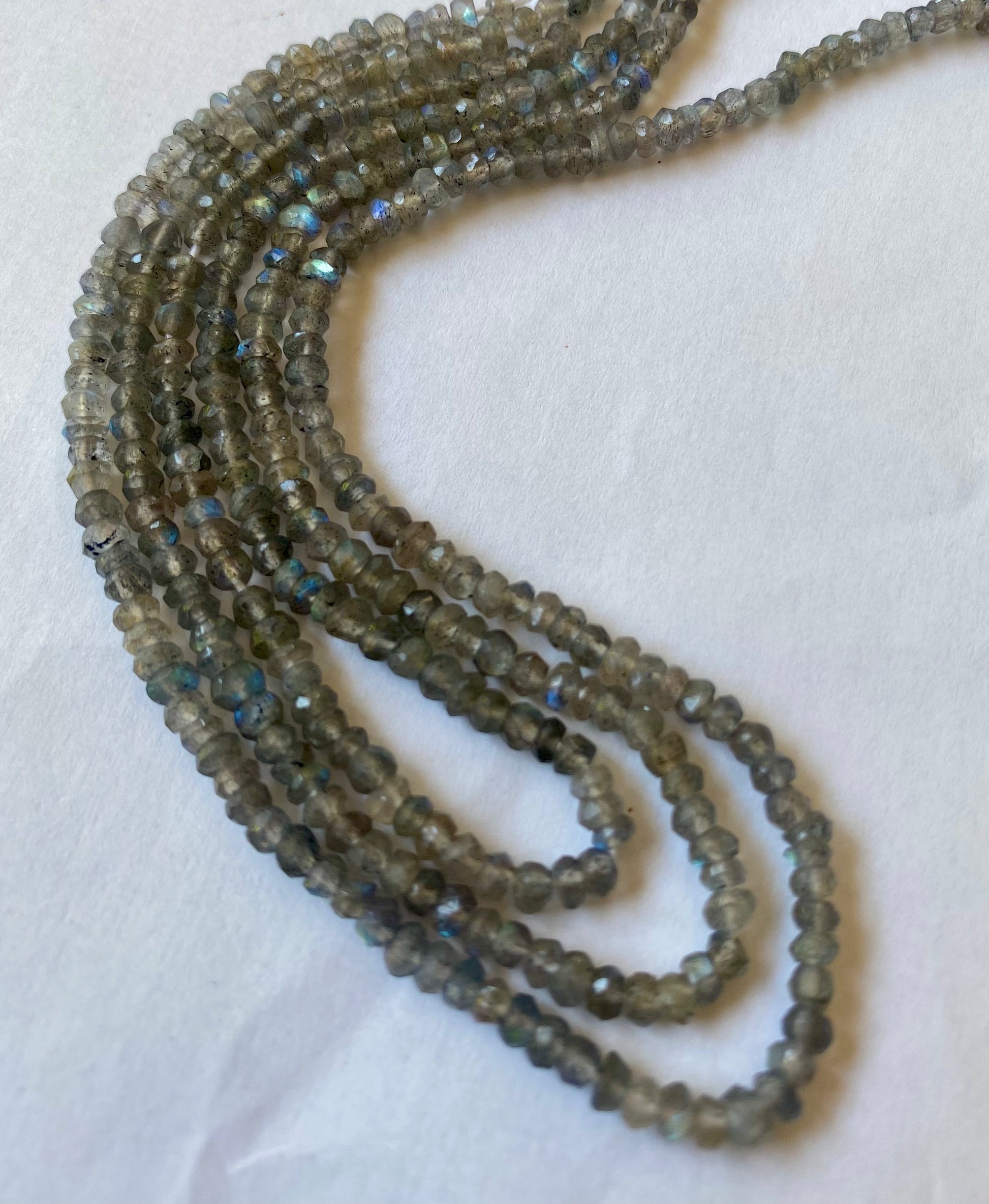 Elegant strands adorned with 3.5mm labradorite faceted rondelle beads, showcasing a sleek design.