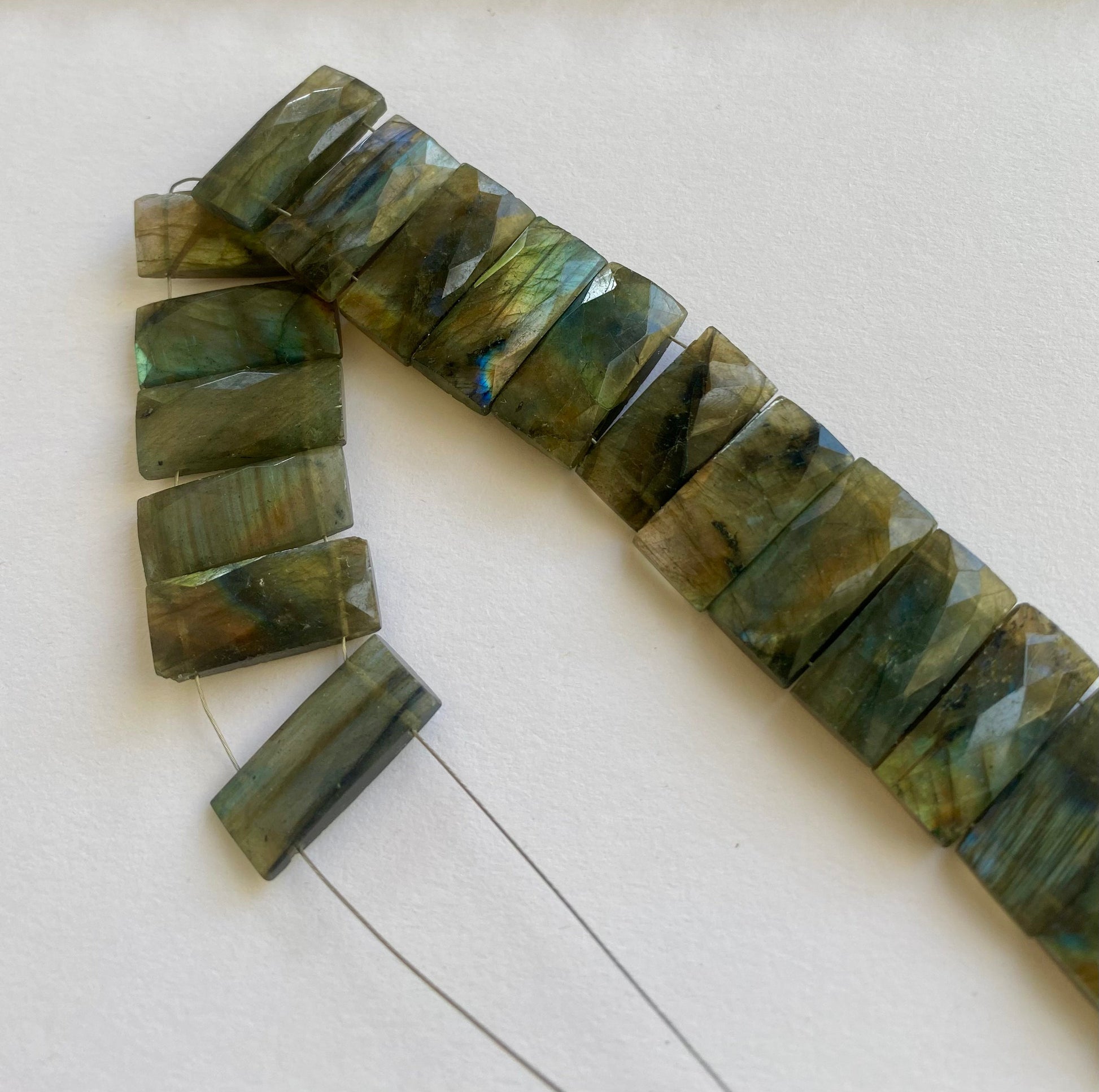 Close-up of 21mm x 9.5–10mm Labradorite rectangle beads showing their natural shimmer.