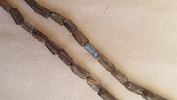 Elegant strand adorned with smooth pipe-shaped semi-precious Labradorite stones.