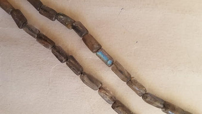 Elegant strand adorned with smooth pipe-shaped semi-precious Labradorite stones.