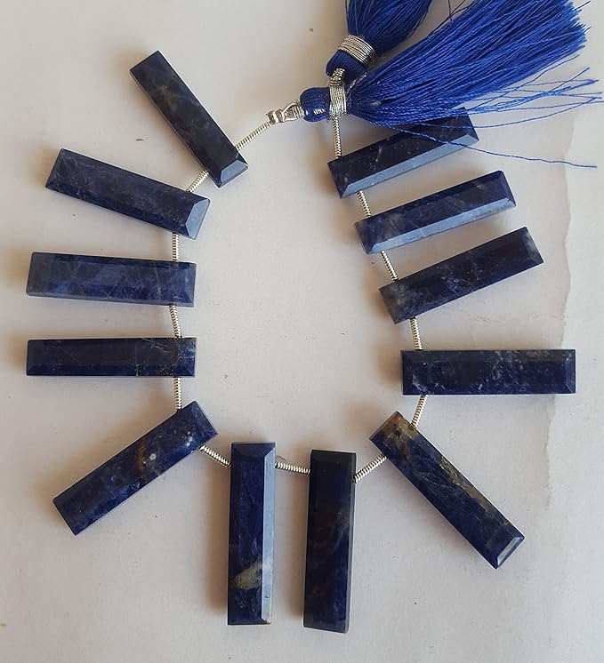  A vibrant blue gemstone bead strand, adorned with lapis lazuli faceted briolette gemstones.