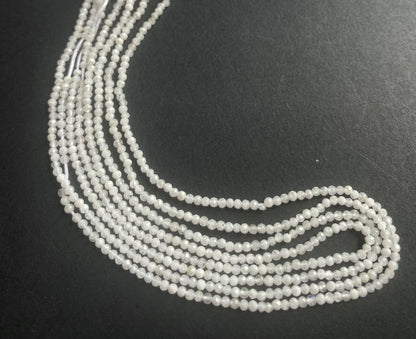  A vibrant strand of 2.1mm white moonstone faceted rondelle beads, highlighting their natural elegance and charm.