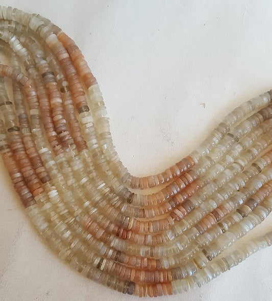 Strand featuring smooth wheel moonstone gemstones, ranging from 5mm to 5.5mm, in a stunning brownish white hue.