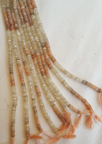 A gemstone bead strand showcasing moonstone smooth wheel gemstones.