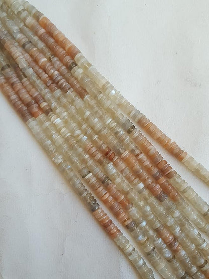 Vibrant gemstone bead strands, adorned with moonstone smooth wheel natural gemstones.
