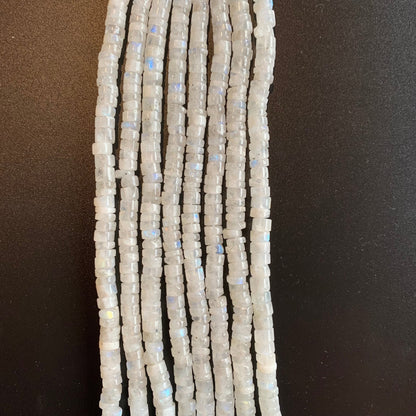 Close-up of Moonstone smooth wheel beads, highlighting their soft glow and natural translucency.